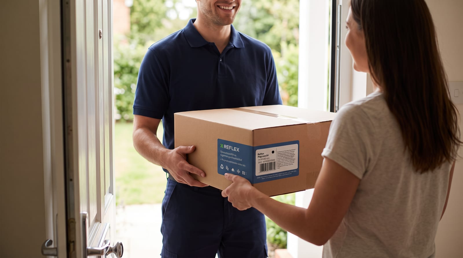 Courier handing a boxed ReFlex product to a customer in a doorway