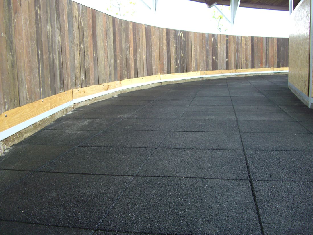 Finished rubber tile floor in the covered horse walker