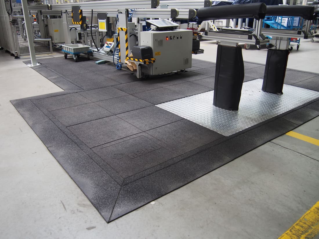 Anti-fatigue rubber matting at an assembly workstation